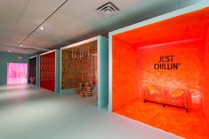 an art gallery with colorful walls and artwork on the walls that say just chillin