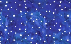 a blue background with white stars in the sky and watercolor paint on it's surface