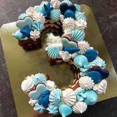 a cake with blue and white decorations on it