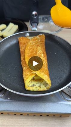 an omelet is being cooked in a frying pan