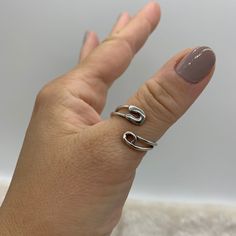 ❤️Silver Safety Pin Ring ❤️ ❤️Introducing our Silver Safety Pin Ring, a unique and stylish accessory that will elevate any outfit! This minimalist piece is perfect for those who want to make a statement with their jewelry without going overboard. The sleek design will make you feel both happy and special every time you wear it. ❤️Made with durable silver plating, this ring is specially designed to fit on the thumb and other fingers, thanks to its adjustable open ring design. You can wear it alone or stack it with other rings for a trendy look. It's a great addition to any jewelry collection and makes for a perfect Mothers Day Gift for Her. ❤️We're committed to providing excellent customer service, so we're offering free shipping and a 15-day return policy for our customers. If for any reas Safety Pin Ring, Open Ring Design, Thick Ring, Bypass Ring, Wrap Rings, Open Ring, Safety Pin, Paper Clip, Stylish Accessories