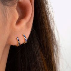 An all-time bestseller with dark blue sapphire zirconia stones. Elegant and classic, these tiny huggie hoops prong-set with brilliant zirconia gemstones are a beautifully dainty addition to your everyday lineup. Subtle, versatile and perfect to mix and match with other earrings.  * D E T A I L S * ∙ Sold individually (1 earring) or as a pair (2 earrings) ∙ Material:  .925 Sterling Silver or 18K Gold Plated over .925 Sterling Silver ∙ Stone: Blue Zirconia  ∙ Dimensions: Hoop Diameter: 10mm // Wid Blue Huggie Hoop Earrings For Pierced Ears, Blue Sterling Silver Huggie Earrings, Blue Huggie Hoop Earrings, Blue Small Hoop Huggie Earrings For Everyday, Blue Small Hoop Huggie Earrings In Sterling Silver, Blue Huggie Hoop Earrings For Everyday, Everyday Blue Huggie Hoop Earrings, Sapphire Hoop Earrings As Gift, Gift Sapphire Hoop Earrings