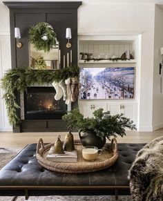 a living room filled with furniture and christmas decorations