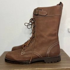 "1990s Brown Lace-Up Boots 1990s Brown Boots from the 1990s! Made with faux suede. Laces up on the front. Has a buckle closure on the front to adjust calf width. Tagged a size 38 - fits up to a US 8. Measurements: Insole Length: 9.5\" Toe Box Width: 3.5\" Calf Width: 12\" Heel Height: 1\" Total Height: 10\" Condition: Excellent, no flaws to note." Caterpillar Boots, White Playsuit, Brown Leather Ankle Boots, Frye Boots, The 1990s, Brown Leather Boots, Work Boots, Leather Ankle Boots, Brown Boots