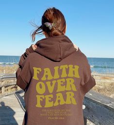 Step into each day with a sense of empowerment and positivity with our "Faith Over Fear Sweatshirt." This sweatshirt is not just a garment; it's a declaration. Featuring a powerful "Faith Over Fear" message, it serves as a reminder to embrace faith and courage in the face of challenges. The oversized and trendy design adds a stylish touch to your wardrobe, making it perfect for those who want to express their faith with flair. Whether you're looking for a unisex sweatshirt for yourself or a meaningful gift for someone special, let this sweatshirt be a beacon of hope and a symbol of unwavering faith. Variety of Colors: Sweatshirt: Sand, Maroon, Light Pink, Sport Grey, Navy T-Shirt: Heather Dust, Heather Maroon, Pink, Athletic Heather, Heather Nav Our custom shirts are the perfect gift for y John 1 12, Pray Shirt, Oversized Aesthetic, God's Presence, Aesthetic Gift, Trendy Aesthetic