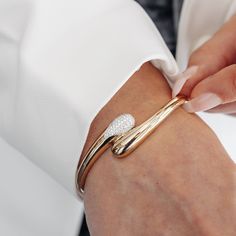 Add some personality to your bracelet stack with our paint drop bypass bangle bracelet! Made of high polished 14K yellow gold, this sleek piece features a gentle taper and one side adorned with pave Diamonds. Inject some style into your look with this unique and playful bangle. Natural Diamonds: 0.40ctw 14K Yellow Gold 48 x 58 Wrist (Small-Medium) Side Clasp Luxury Minimalist Open Band Bracelets, Quick Nail Art, Paint Drop, Bracelet Stack, Pave Diamonds, Bangle Bracelet, Leather Sandals, Natural Diamonds, Bangle Bracelets