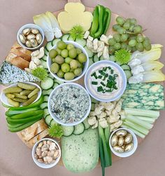 a platter filled with lots of different types of food on top of a table