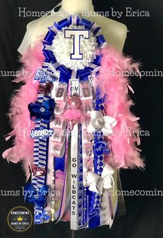 a mannequin is adorned with pink, white and blue ribbons