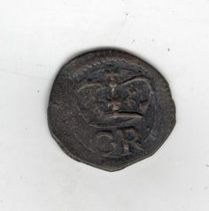 an old coin with a face on it