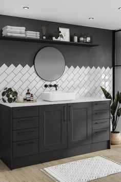 a bathroom with a sink, mirror and shelving unit in the middle of it