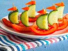 several slices of cucumber and tomato on a plate