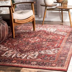 a living room area with a chair and rug