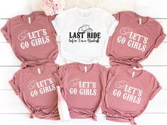 four pink shirts that say let's go girls