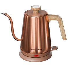 a copper colored coffee pot with wooden handle