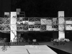 a black and white photo of a building with scaffolding on it