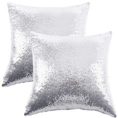 two silver sequin pillows on white background