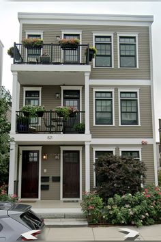 a two story apartment building with balconies on the second floor