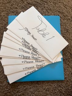 several envelopes with writing on them sitting on the floor