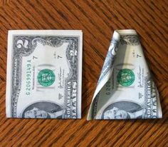 an origami airplane made out of one dollar bill