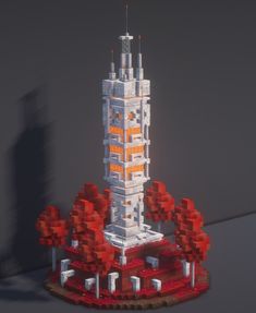 a model of a tall building made out of legos with trees in the foreground