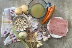 the ingredients for this meal are laid out on top of each other, including carrots, onions, beans, and milk