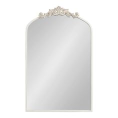 a large white mirror with an ornate design on the top and bottom half of it