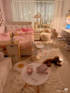 a bedroom with white furniture and pink bedding