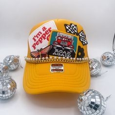 Introducing our exclusive Trucker Hat with a twist - each hat is a masterpiece, adorned with carefully curated patches for a unique touch. Crafted for the bold and the adventurous, this hat is more than an accessory; it's a statement of individuality. With its breathable mesh back and adjustable snap closure, it's as comfortable as it is stylish. Stand out from the crowd with our one-of-a-kind Trucker Hat and let your personality shine. Bride Trucker Hat, Hat Bar, Dope Hats, Custom Trucker Hats, Cropped Graphic Tees, Boutique Ideas, Diy Things, Hat Ideas, Happy Dance