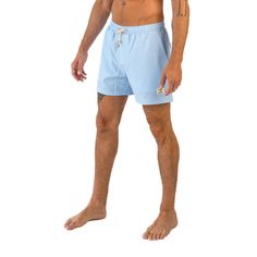 Make a splash this summer with East x East Sea Breeze baby blue men's swim shorts. The serene color and sleek design are perfect for a day at the beach or lounging poolside. Crafted from premium sustainable materials, these shorts are not only stylish but eco-friendly too. The quick-drying fabric and elasticated waistband ensure a comfortable and secure fit, whether you're swimming or playing beach volleyball. With their timeless style and sustainable materials, our Sea Breeze shorts are a must-