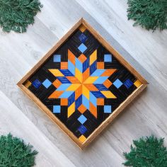 a wooden box that has some colorful designs on it