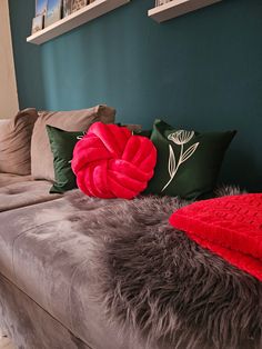 a couch with pillows and blankets on it