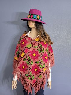 This gorgeous Mexican Artisanal Poncho is perfect for the cold months ahead! The multicolor Ethnic design adds that perfect pop of color and style to your wardrobe. This poncho is completely hand embroidered by cross stitch and handmade on a loom by Mexican Artisans in Puebla, Mexico. This poncho is knit, has open sides and it comes in one size so anyone ranging from size Small to Extra Large will be able to wear it. Bohemian Shawl Patterns For Winter, Traditional Poncho For Beach In Fall, Traditional Fall Poncho For Beach, One Size Traditional Beach Shawl, Bohemian Multicolor Poncho For Festival, Multicolor One Size Poncho For Festivals, Handmade Bohemian Long Poncho, One Size Cape Poncho For Festival, One Size Multicolor Poncho For Festival