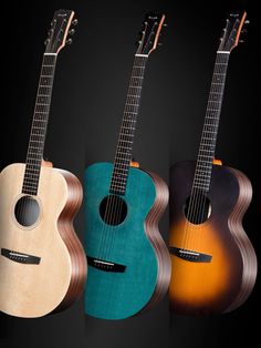 three guitars are lined up against a black background and one is brown, the other is blue