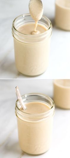 a spoon with some food in it on top of a jar