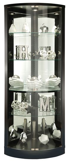 a display case filled with lots of silver items on top of a black countertop