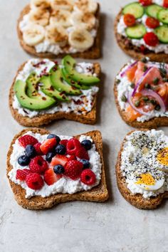 four toasted sandwiches with fruit, cucumbers, and cream cheese on them