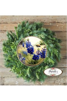 a plate with blue flowers on it sitting on top of a wooden table next to a sign