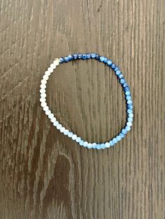 Blue ombre beaded bracelet, perfect for a boy mom new mom gift or mothers day, or anyone who loves blue!   would make a great gift for a blue color wedding party! On elastic string so one size fits most (7" standard). Adjustable Blue Friendship Bracelets With Faceted Beads, Adjustable Blue Faceted Beads Friendship Bracelets, Light Blue Adjustable Bracelet With Faceted Beads, Adjustable Light Blue Bracelets With Faceted Beads, Adjustable Light Blue Bracelet With Faceted Beads, Blue Beaded Flexible Stretch Bracelet, Blue Beaded Stretch Bracelet, Flexible Blue Beaded Stretch Bracelet, Adjustable Blue Bracelet With Faceted Beads