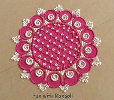 a pink and white doily with flowers on it