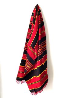 This beautiful handmade cotton scarf, known locally as a "Netela," is crafted by artisans from the Ethiopian Dorze tribe. Known for their masterful weaving techniques, the Dorze create intricate, lightweight, and breathable scarves perfect for any occasion. Whether used as a fashion accessory or displayed as a piece of tribal art, this authentic scarf brings the rich culture and traditions of Ethiopia into your home. A wonderful gift for lovers of handmade textiles and cultural heritage. Handmade Textiles, Cotton Scarf, Cultural Heritage, Weaving Techniques, Ethiopia, Scarf Wrap, Gift For Lover, Scarf Accessory, Weaving