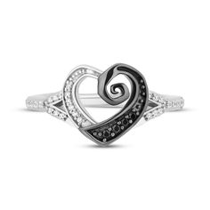 This sparkly style from the Disney Treasures collection features the iconic spiral inspired by Disney's The Nightmare Before Christmas swept into a heart-shaped design. The look shines with vivid round-cut black diamonds in black rhodium and contrasting bright round diamonds that finish the heart and dazzle down the sides of the band. Crafted in sterling silver, the ring has a total diamond weight of 1/8 carat. Available exclusively at KAY Jewelers. ©Disney. Nightmare Before Christmas Ring, Disney Wedding Ring, Nightmare Before Christmas Rings, Finish The Heart, Nightmare Before Christmas Wedding, Heart Shaped Engagement Rings, Enchanted Disney, Disney Treasures, Halloween Ring