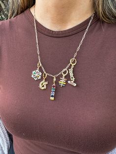 Each charm necklace is unique. With 5 charms per chain, it gives a the necklace a full but balanced look. Heels & Wedges, Hair Accessories Jewelry, Boot Accessories, Top Graphic Tees, Retail Therapy, Wedge Boots, Mens Tees, Charm Necklace, Gifts For Him