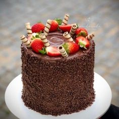 a chocolate cake with strawberries on top