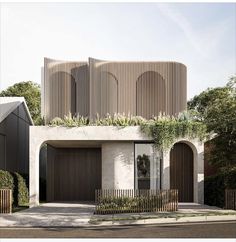 an architecturally designed house with wooden slats on the front and side walls, surrounded by greenery