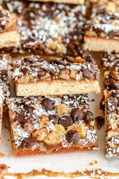 several pieces of chocolate and nuts bars on a tray