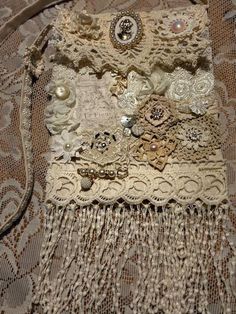 an old purse is sitting on a lace tablecloth with buttons and beads attached to it