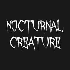 the words, nocturnal creature written in white ink on a black background