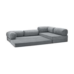 a large gray couch sitting on top of a white floor