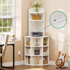 a room with a guitar, desk and shelves