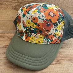 Vintage Floral Fabric bringing back the best looks.   All hats have a terry cloth lining, mesh back, and snap adjustable back. We believe in individual expression,  hand crafting, and getting outside.  Our hats are meant to instill adventure in you whenever you wear them!   Stitching is random.  If you desire a certain color (or don't want a certain color) please write in notes.  All our hats are hand stitched by us, local women,  or our team of lady stay at home mom seamstresses in L.A.  Every hat is unique as they are not mass produced.  We buy our fabrics from small fabric designers or work closely with artists or textile makers. Some fabric is custom made through working directly with artists and made in limited batches.  Customers come back again and again as our hats are comfortable, Playful Outdoor Visor Hat, Spring Mesh Baseball Cap, Spring Mesh Trucker Hat For Outdoor, Spring Outdoor Mesh Trucker Hat, Green Mesh Hat For Outdoor, Green Mesh Outdoor Hat, Green Mesh Summer Hat, Summer Green Mesh Hat, Spring Mesh Trucker Hat